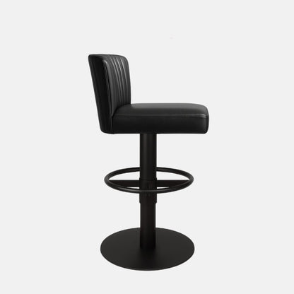 Side view of a black upholstered swivel counter stool with ribbed backrest, black pedestal base, circular footrest ring and round base on a white background.

