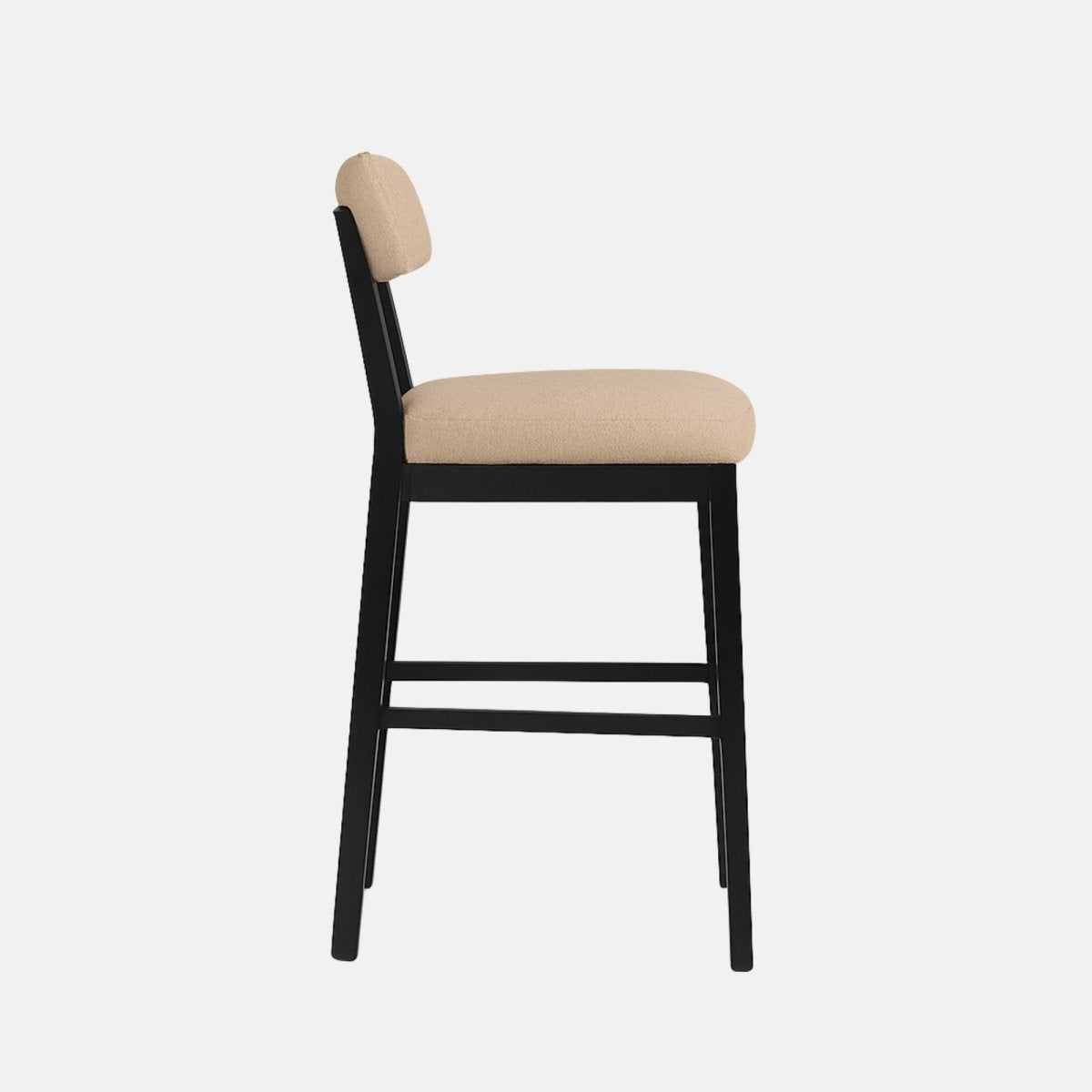 Back view of a modern barstool featuring beige boucle fabric upholstery on the seat and curved backrest, supported by a sleek black wooden frame with a metal footrest, set against a light grey background with soft shadowing.
