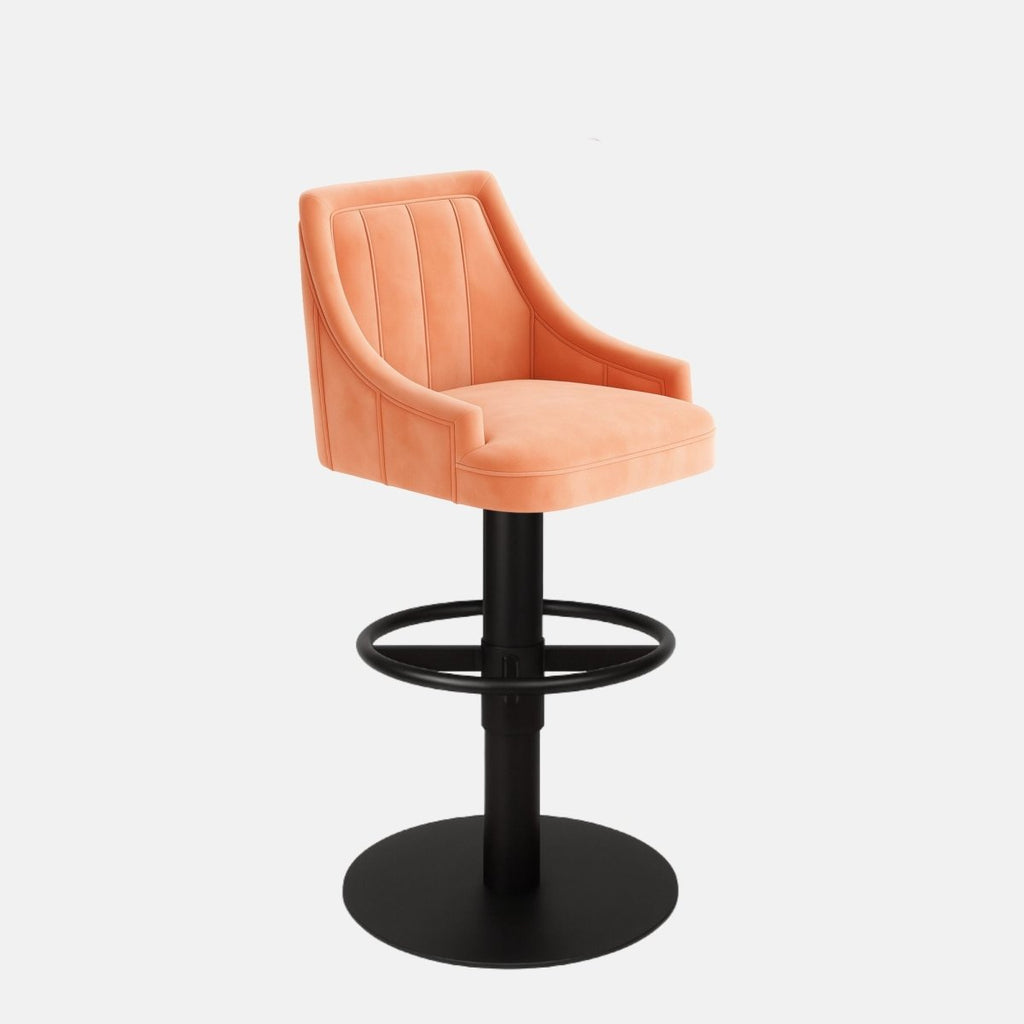 Contemporary coral upholstered bar stool with vertical stitching, curved backrest, and black pedestal base with circular footrest.