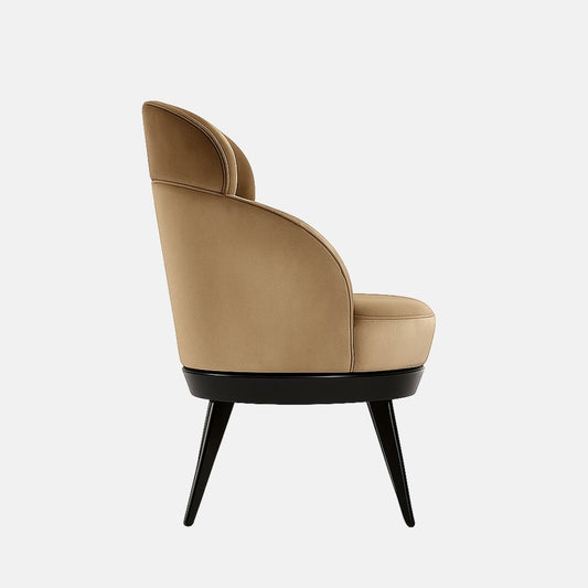 Side view of a beige upholstered accent chair with a curved wraparound back, padded seat, and black tapered legs on a white background.