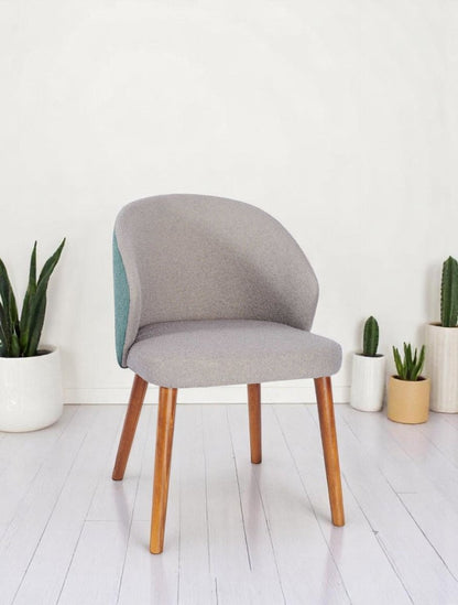 alt="Modern office chair with grey soft fabric seat, contrasting green backrest, and medium oak legs"