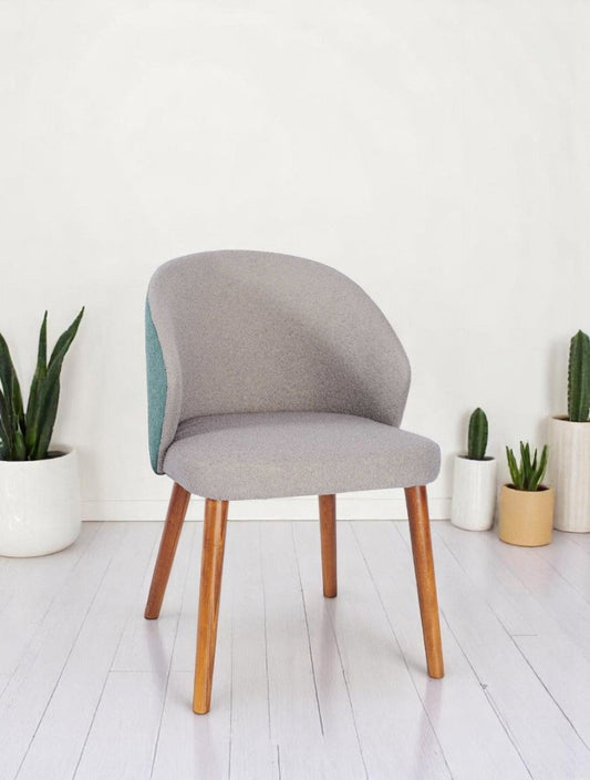 alt="Modern office chair with grey soft fabric seat, contrasting green backrest, and medium oak legs"