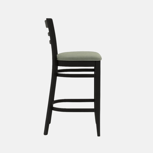 Modern wooden bar stool with black ladder-back design, cushioned seat upholstered in light green fabric, and sturdy black frame with footrest