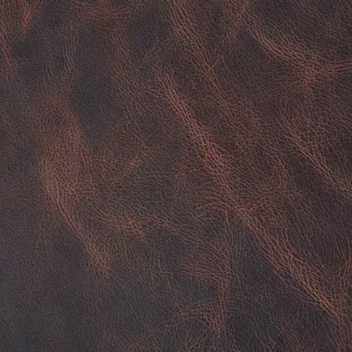 Dark brown leather texture with natural grain used for furniture upholstery