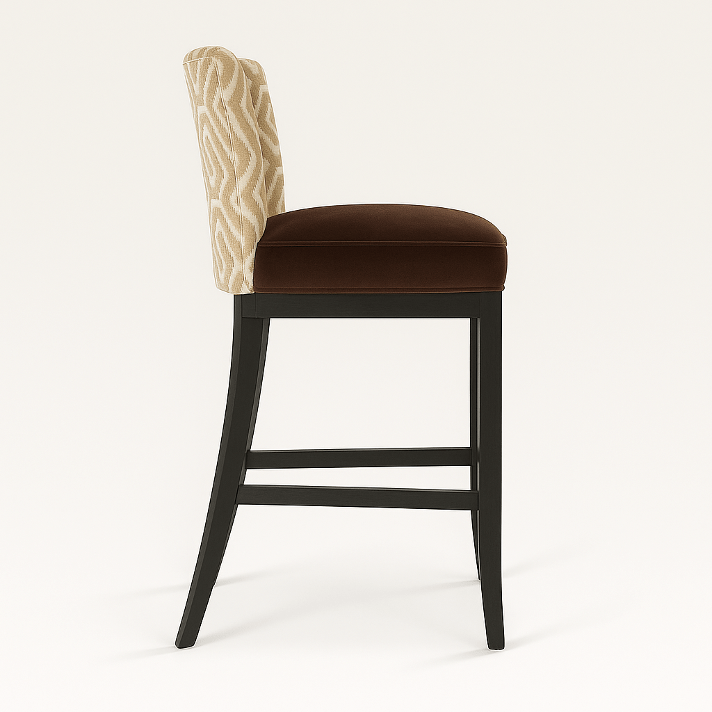 A stylish barstool featuring a geometric beige and cream upholstered backrest with dark brown piping, a plush chocolate brown seat cushion, and a sleek black wooden frame with gently flared legs and a brass-finished footrest, set against a neutral background.
