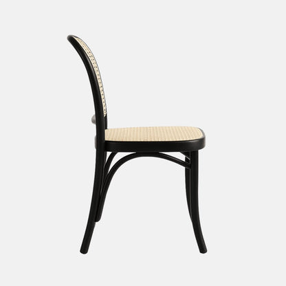 Black bentwood dining chair with natural rattan cane seat and backrest, side profile, modern classic design.

