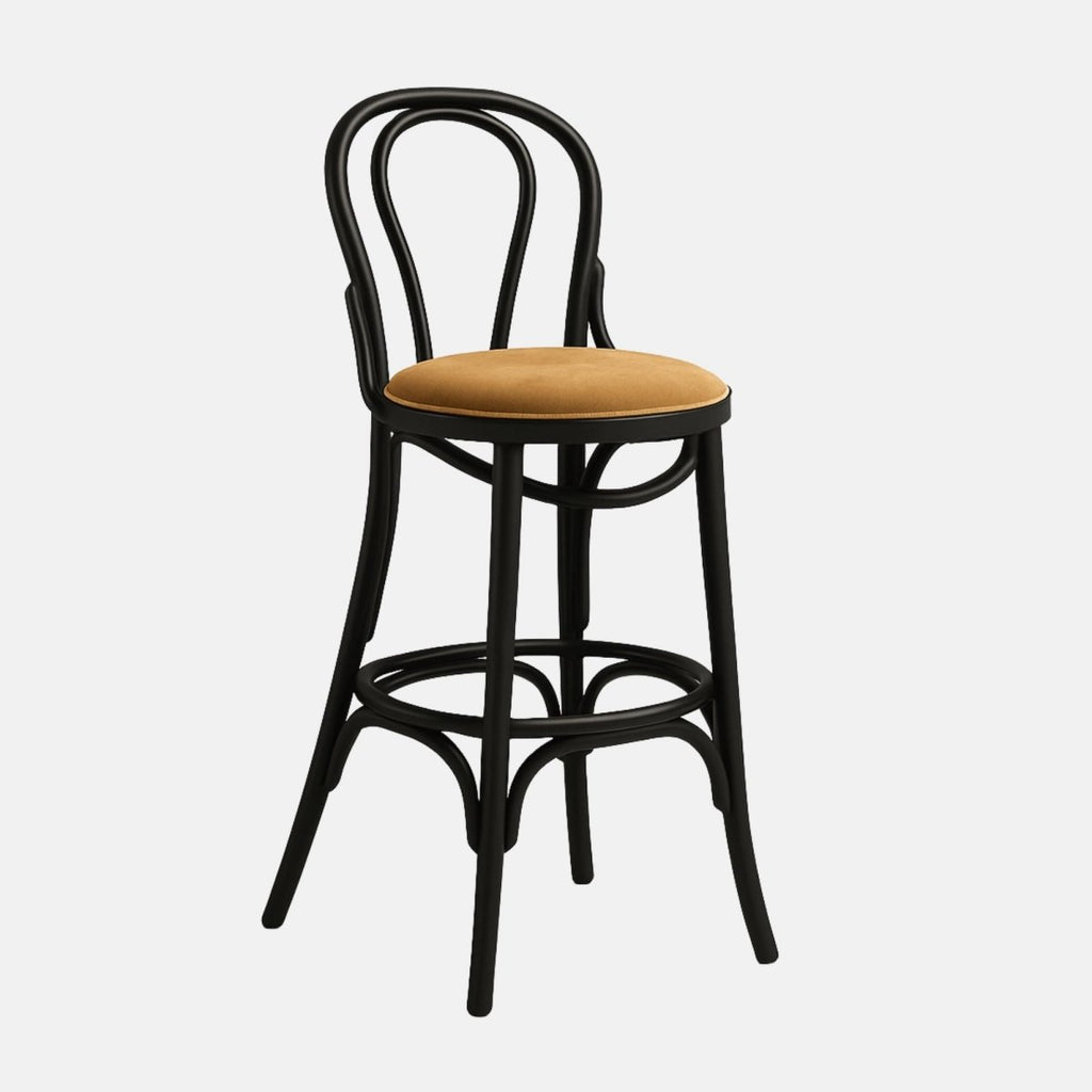Classic bentwood bar stool with curved black frame, round backrest, and cushioned tan upholstered seat with circular footrest support