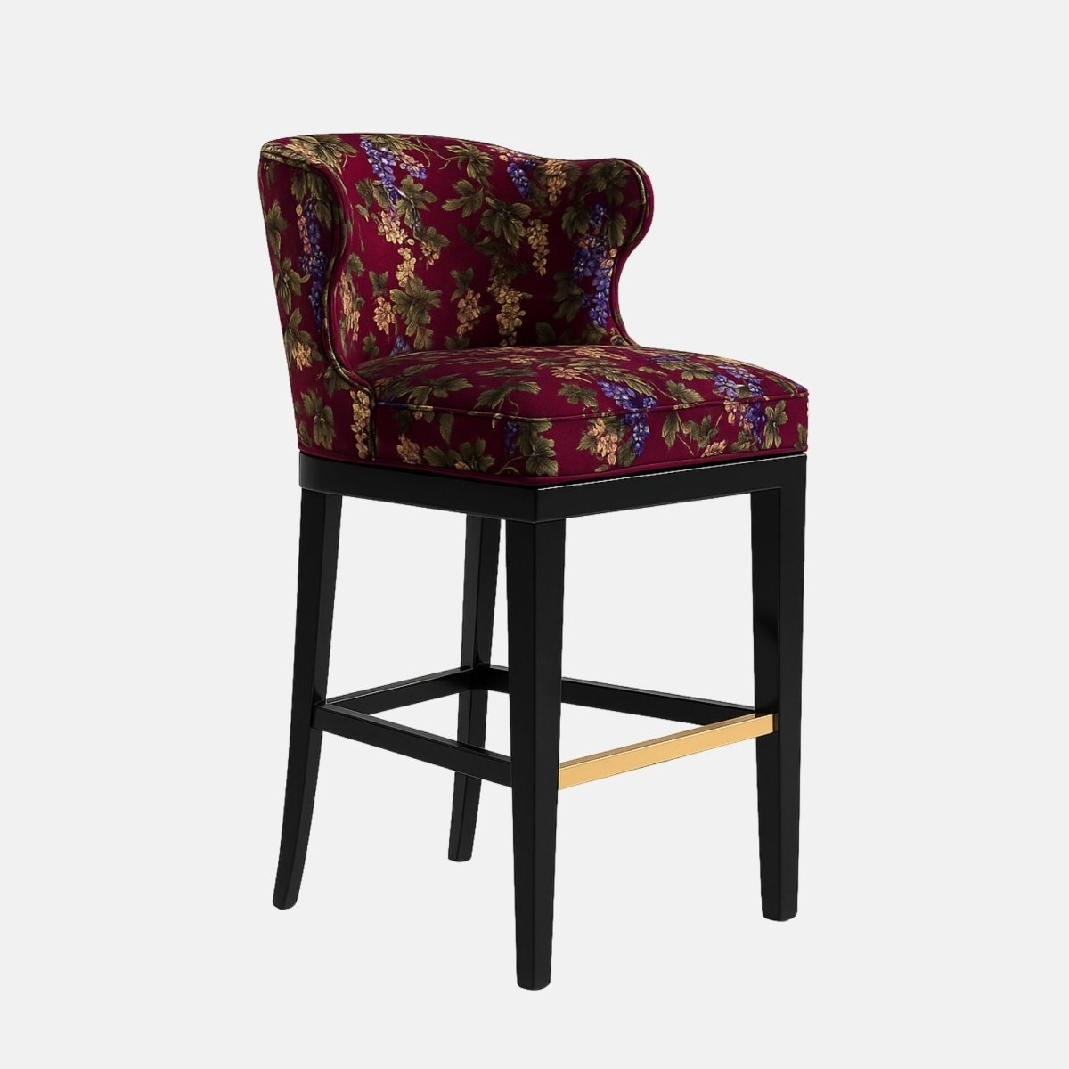 Elegant bar stool with a curved backrest and floral-patterned upholstery in rich burgundy fabric featuring green and purple tones. The frame is black wood with a brass footrest accent, blending classic and contemporary design elements.