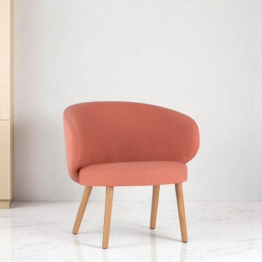 alt="Modern orange lounge chair with quirky, sculptural shape and natural wood legs"
