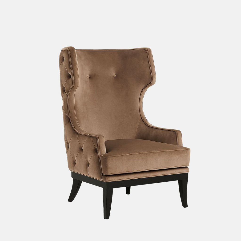 Taupe wingback armchair with a button-tufted cushion, curved panelled backrest, black legs, and geometric patterned fabric on the outer sides