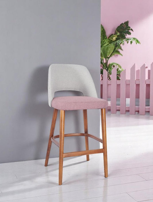 alt="Padded kitchen stool with ergonomic curved backrest and medium oak legs for added comfort"