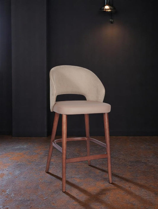 alt="Chic creme linen upholstered kitchen stool with comfortable seat and medium oak legs"