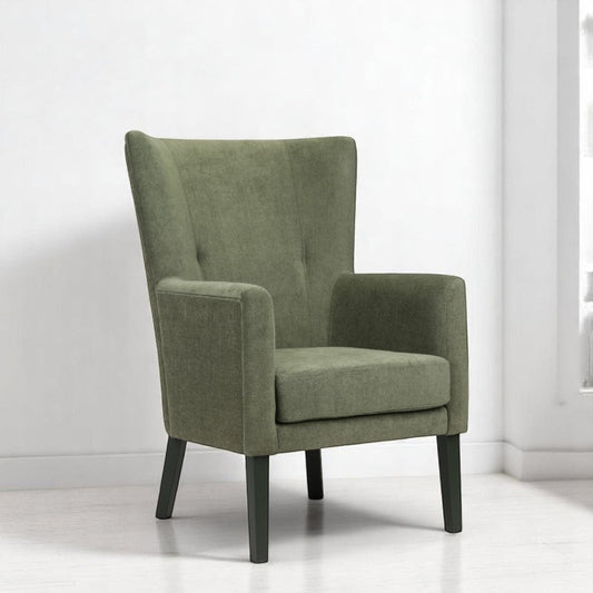 alt="Modern green lounge chair with wide backrest, black legs, and two button details for added elegance"