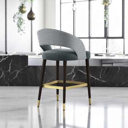 alt="Luxurious modern bar stool with soft fabric seat and gold metal leg rest for a refined look"