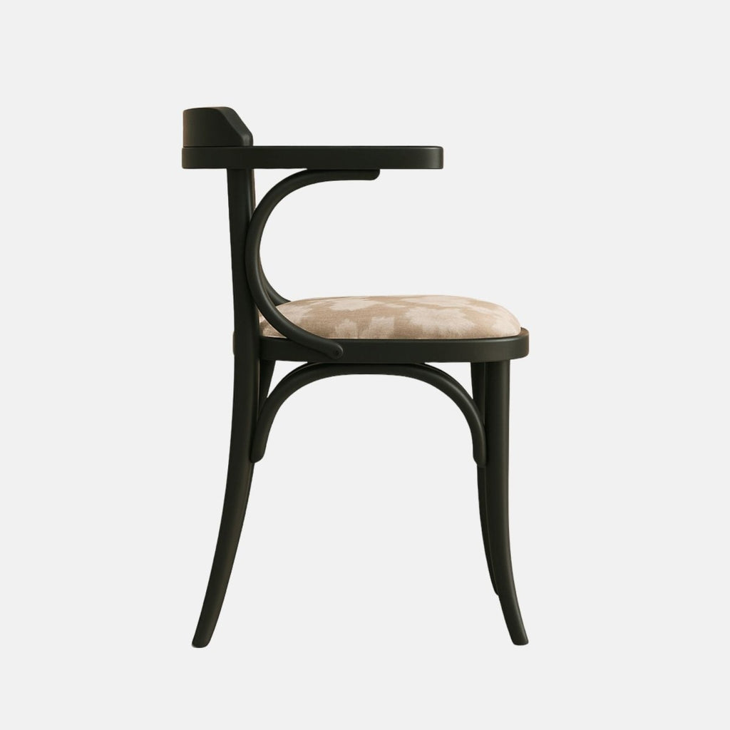 Designer bentwood armchair in black finish with soft beige patterned upholstery, perfect for luxury dining or café seating