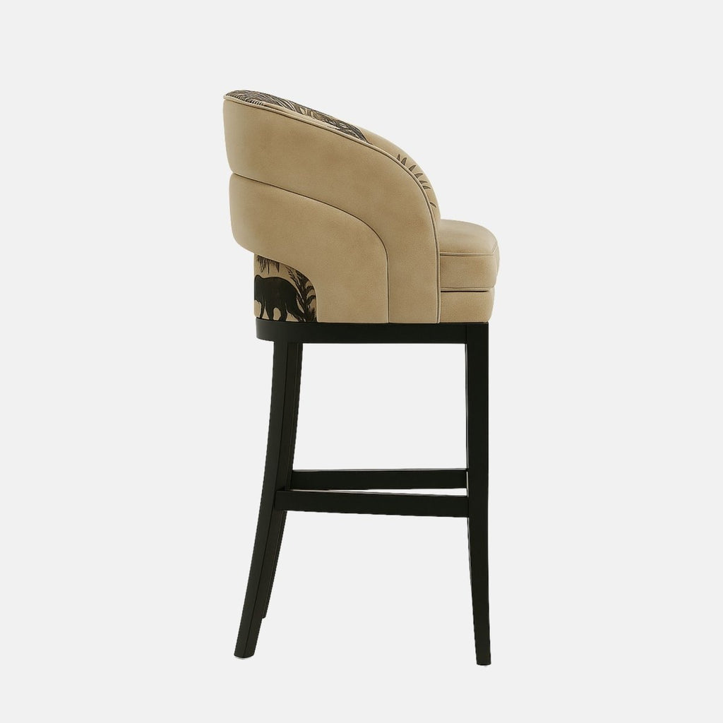 Modern bar stool with a mid-height curved backrest and smooth green leather upholstery. The seat and back feature subtle vertical channel detailing. Supported by a black wooden frame with a brass footrest accent, the design combines elegance and comfort