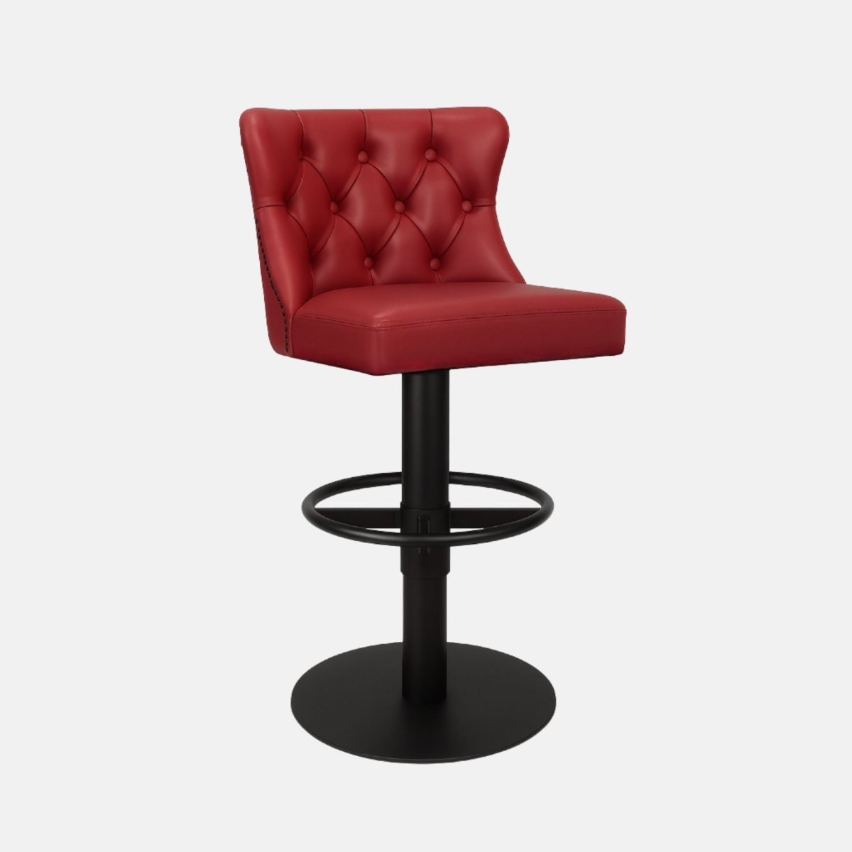 Red leather 360° swivel bar stool with deep button-tufted backrest and matte black metal base — bespoke handcrafted counter stool inspired by classic Chesterfield design.
