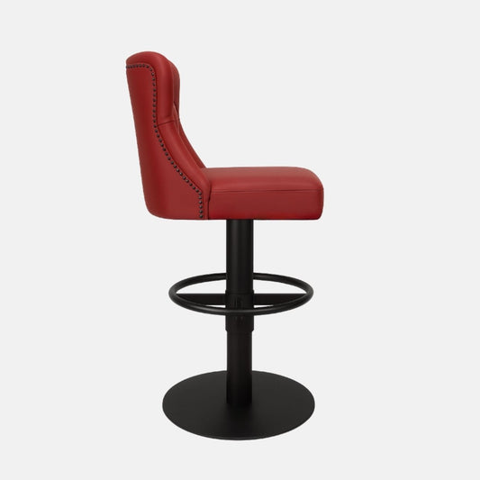 Red leather 360° swivel bar stool with deep button-tufted backrest and matte black metal base — bespoke handcrafted counter stool inspired by classic Chesterfield design.