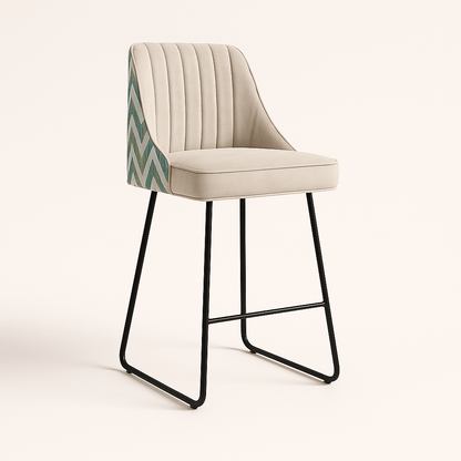 Modern bar and kitchen counter stool with a cream upholstered seat and vertical channel tufting, featuring a chevron-patterned fabric on the back and a sleek black metal sled base, set against a neutral background.