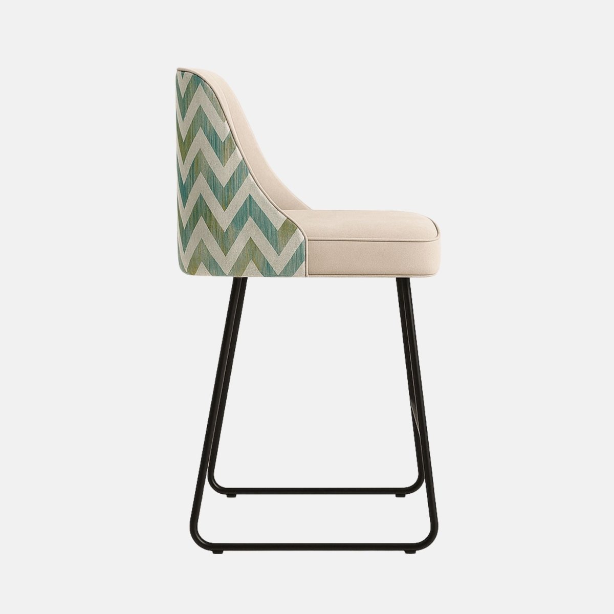 Contemporary bar chair with beige cushioned seat and backrest, vertical stitched design, slim black metal sled legs, and green chevron fabric on the chair’s sides and back.