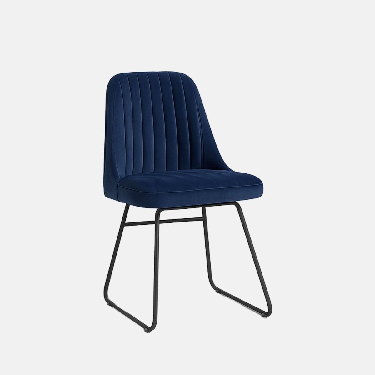 Modern dining chair with navy blue upholstered vertical-stitched backrest and seat, supported by sleek black metal sled legs