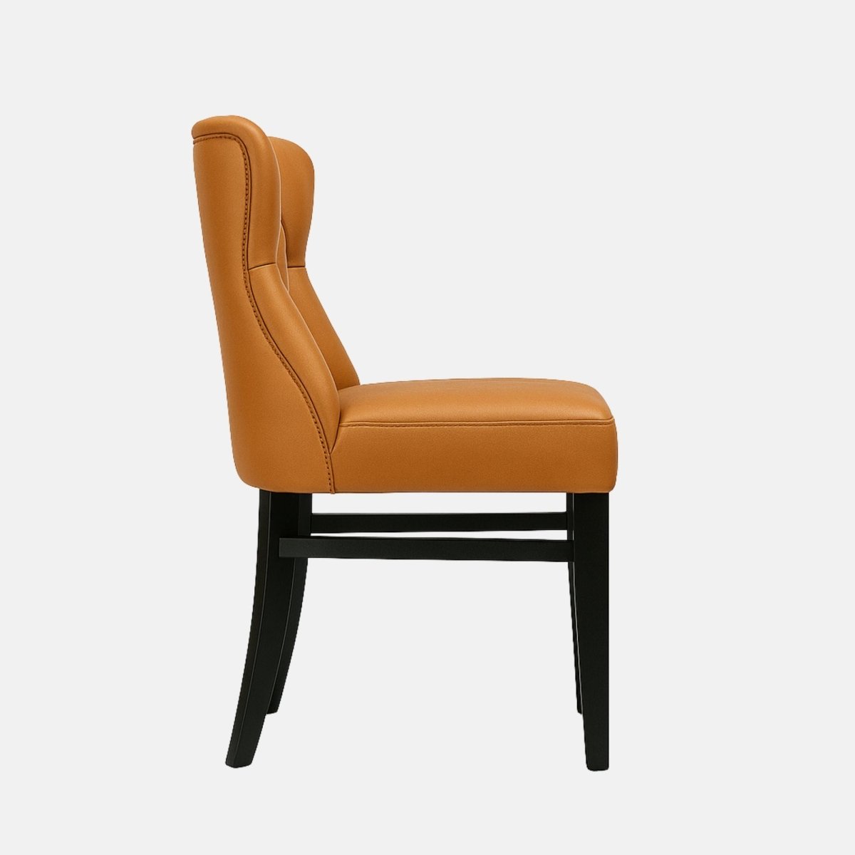 Honoré Dining Chair in tan leather with deep button-tufted Chesterfield backrest and solid black wood legs – handmade luxury seating