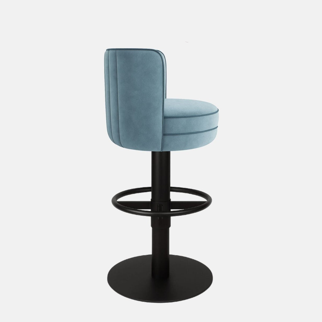 Light blue velvet 360° swivel bar stool with vertical channeled upholstery and black powder-coated base — bespoke made-to-order counter stool for modern kitchens and bars.