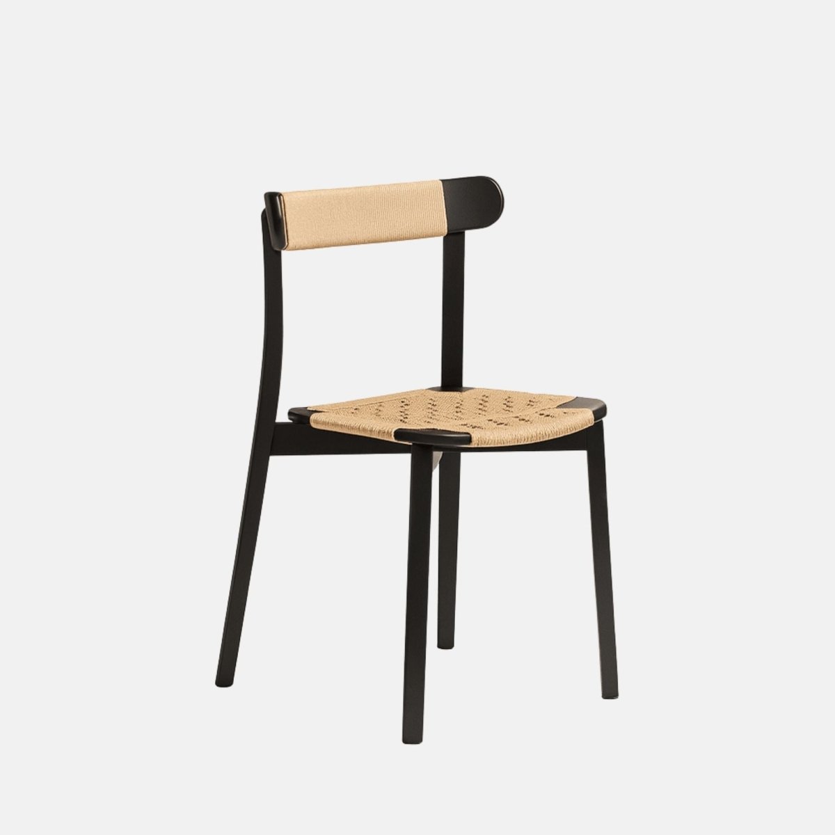 Minimalist dining chair with a black wooden frame, woven natural cane seat, and matching woven detail on the backrest.