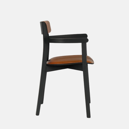 Modern armchair with a slim black wooden frame and armrests, featuring caramel brown leather upholstery on the seat and rounded backrest with vertical stitching, set against a light grey background