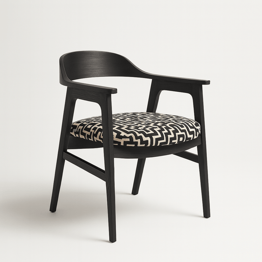 A side view of a modern black wooden armchair with a rounded backrest and arm support. The seat cushion is upholstered in a bold black and beige geometric pattern. The chair is set against a plain white background, casting a soft, realistic shadow.