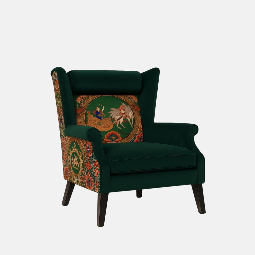 Dark green wingback armchair with a cushioned seat and headrest, featuring vibrant patterned upholstery on the back and sides with a central embroidered scene depicting a figure and a winged horse