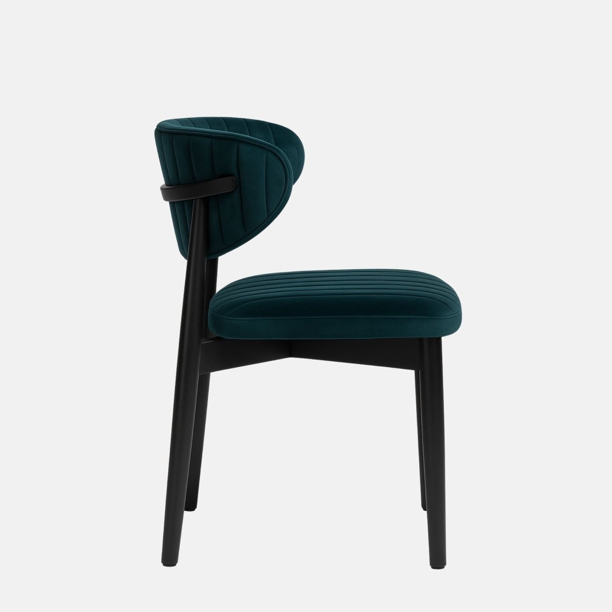 Modern dining chair with a black wooden frame and legs, featuring deep teal velvet upholstery on the curved backrest and seat with vertical channel stitching, set against a light grey background