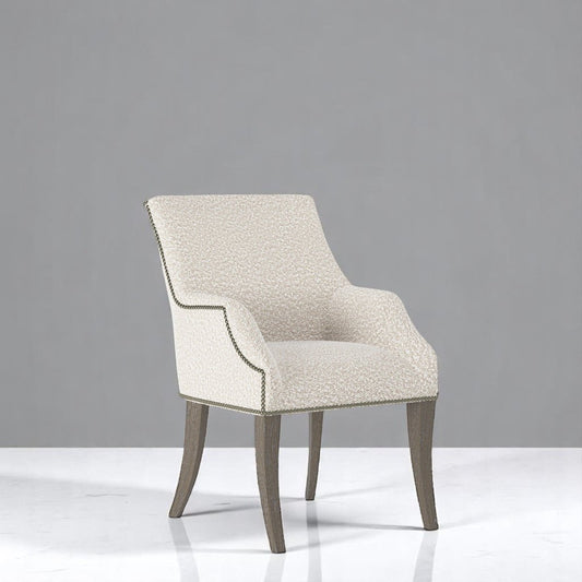 alt="Classic profiled armchair in natural tones with elegant grey legs for a timeless look"