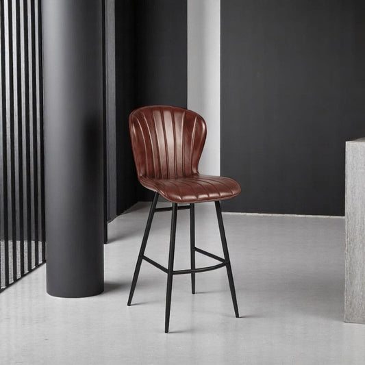 alt="Contemporary metal bar stool with padded leather seat and gently curved back support"