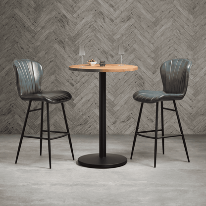 alt="Comfortable grey leather bar stools with durable metal base and refined finish"
