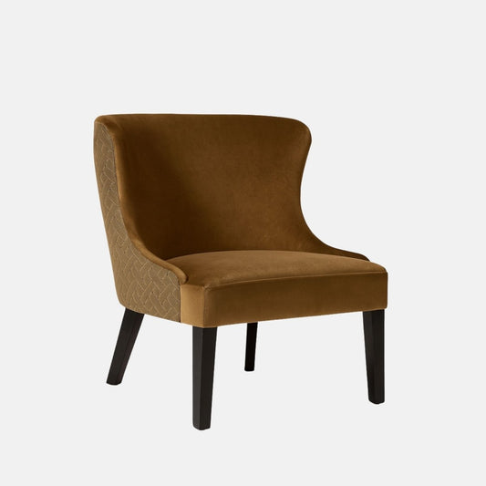 A modern accent chair with a high curved backrest, upholstered in brown velvet fabric with a subtle quilted pattern on the sides, supported by four dark wooden legs.