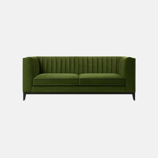 This is a green upholstered sofa with vertical channel tufting along the back and sides. It features two seat cushions, a boxy frame, and a low-profile black wooden base with tapered legs. The overall design is sleek and contemporary, giving it a sophisticated yet minimalist look — perfect for modern commercial or hospitality interiors.