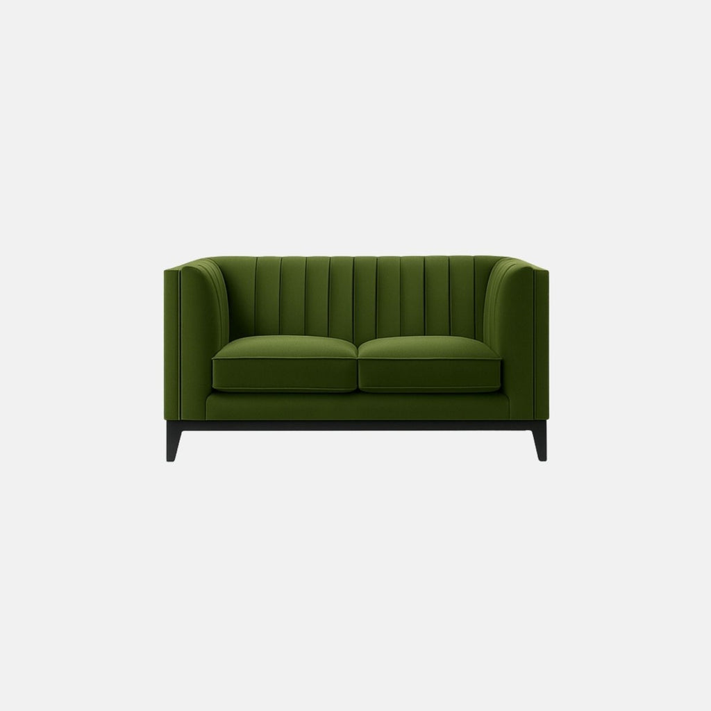 This is a green upholstered sofa with vertical channel tufting along the back and sides. It features two seat cushions, a boxy frame, and a low-profile black wooden base with tapered legs. The overall design is sleek and contemporary, giving it a sophisticated yet minimalist look — perfect for modern commercial or hospitality interiors.