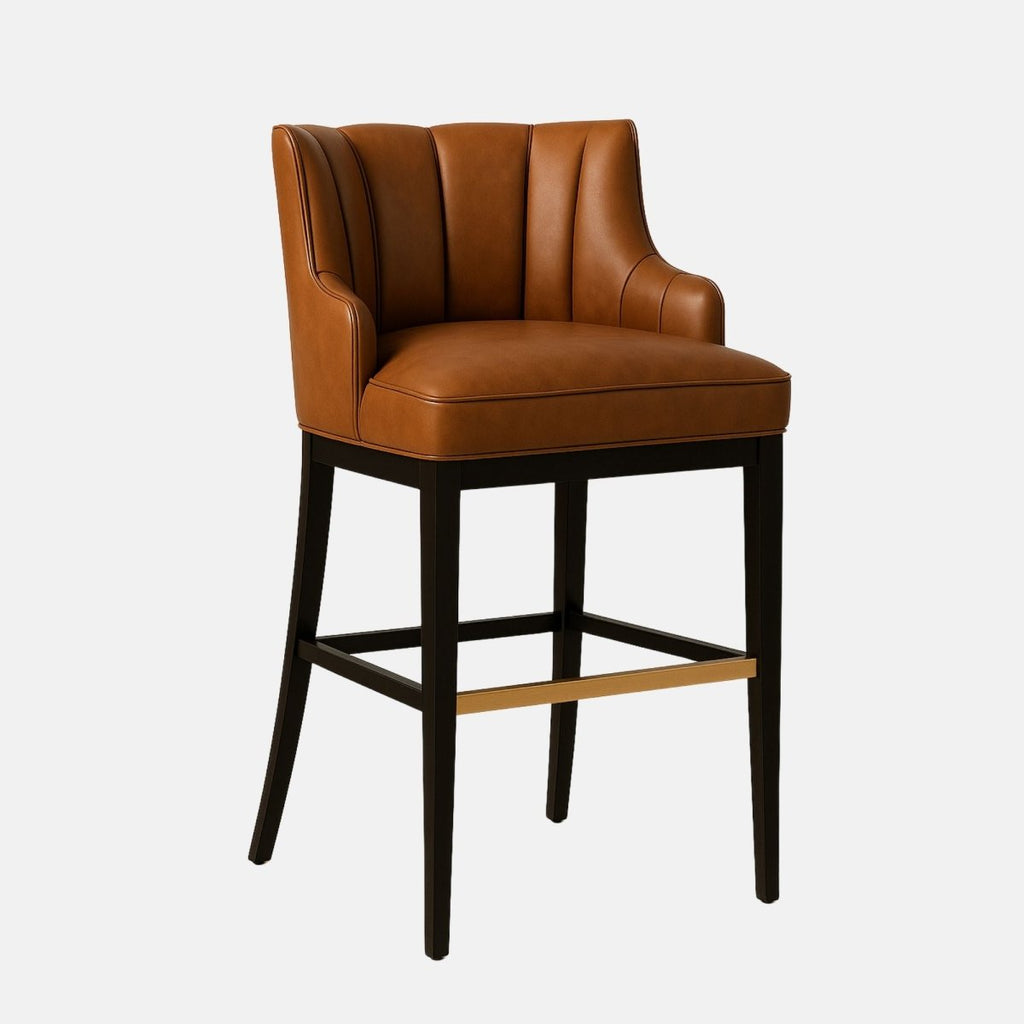 Brown leather bar stool with a curved, channel-tufted backrest, black tapered legs, and a gold metal footrest.