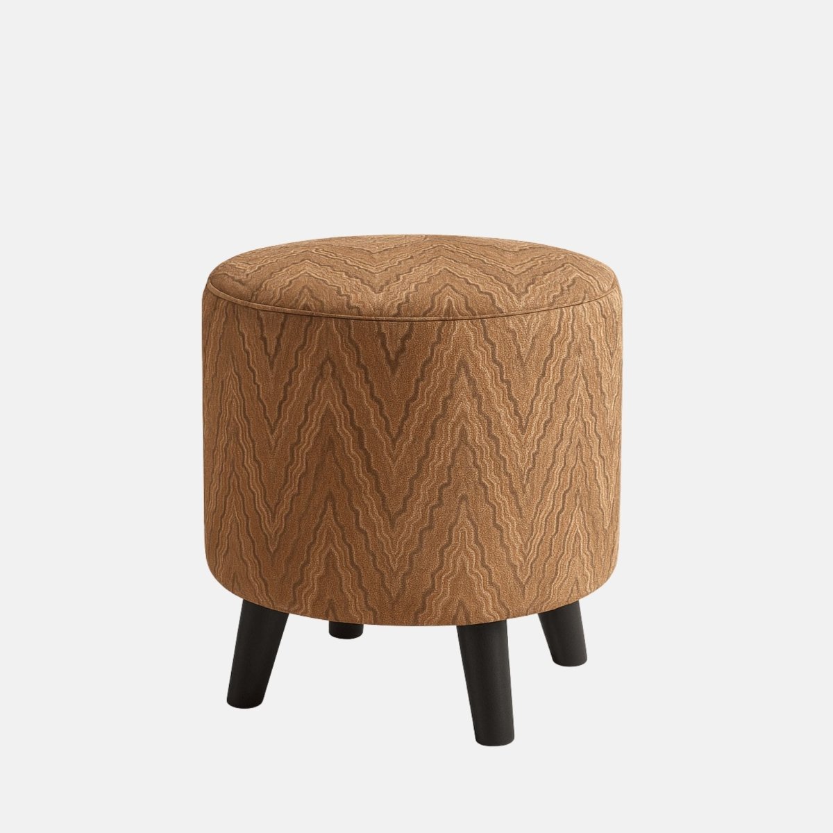 Round upholstered ottoman stool with brown zigzag patterned fabric and four short black wooden legs