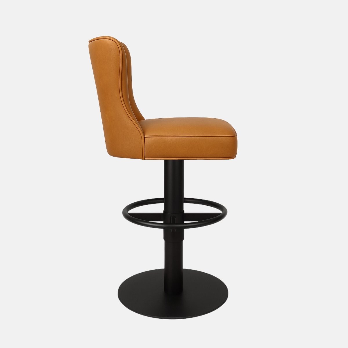 Tan leather 360° swivel bar stool with fluted backrest and black powder-coated base — bespoke made-to-order counter stool combining modern design and luxury craftsmanship.