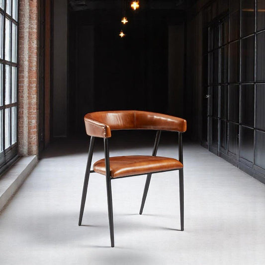 alt="Luxurious brown leather armchair with contemporary metal legs and minimalist design"