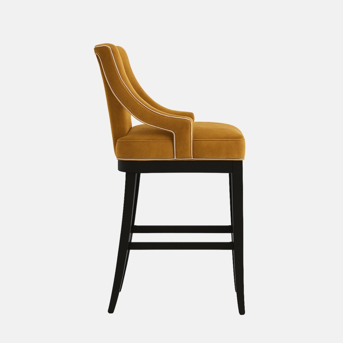 Sophisticated bar stool with sculpted open-back armrests, upholstered in mustard yellow velvet. The seat and back feature smooth, plush cushioning, supported by a black wooden frame with a brass footrest accent for a luxurious modern look.