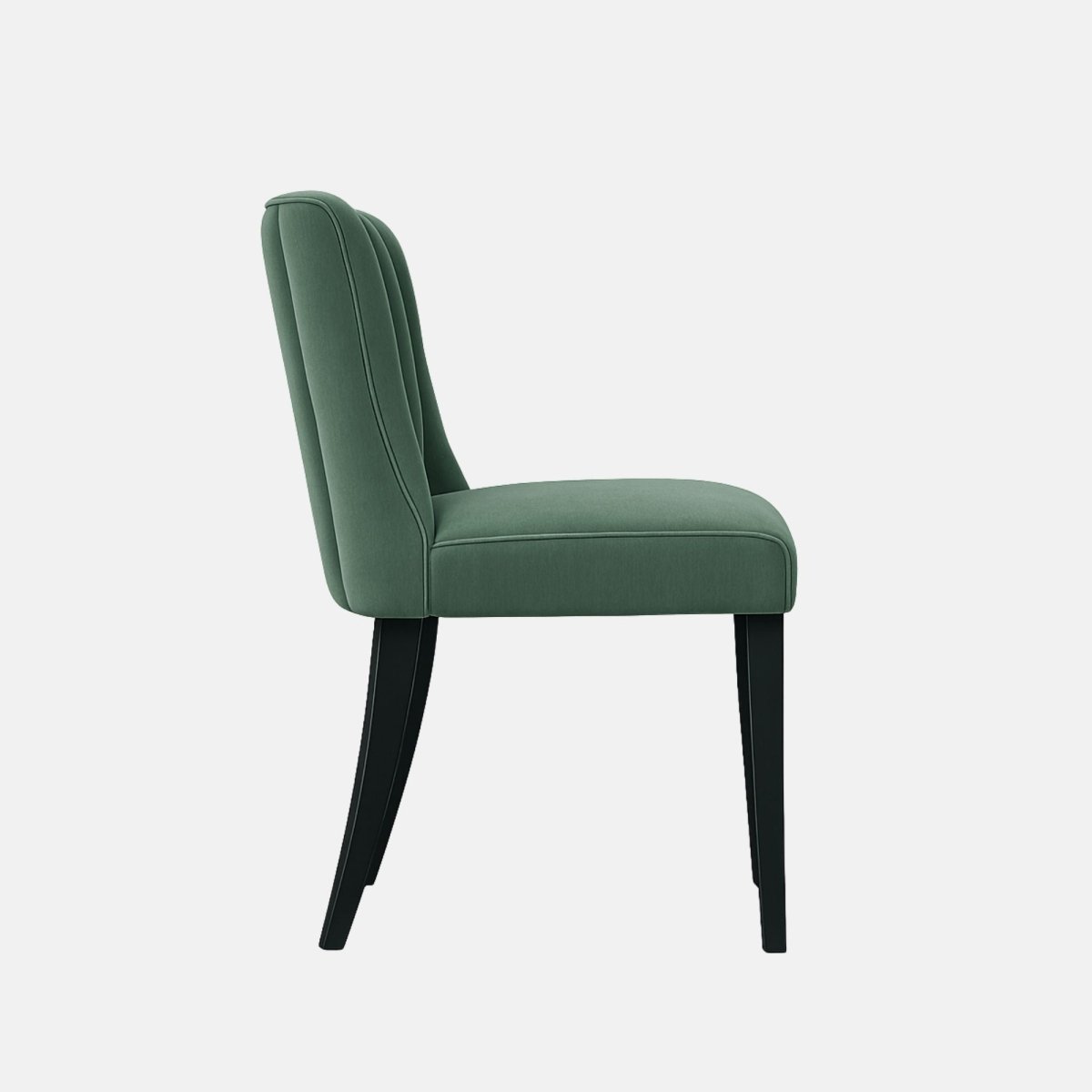 “Green upholstered dining chair with vertical channel tufted backrest and black wooden legs, shown against a plain white background