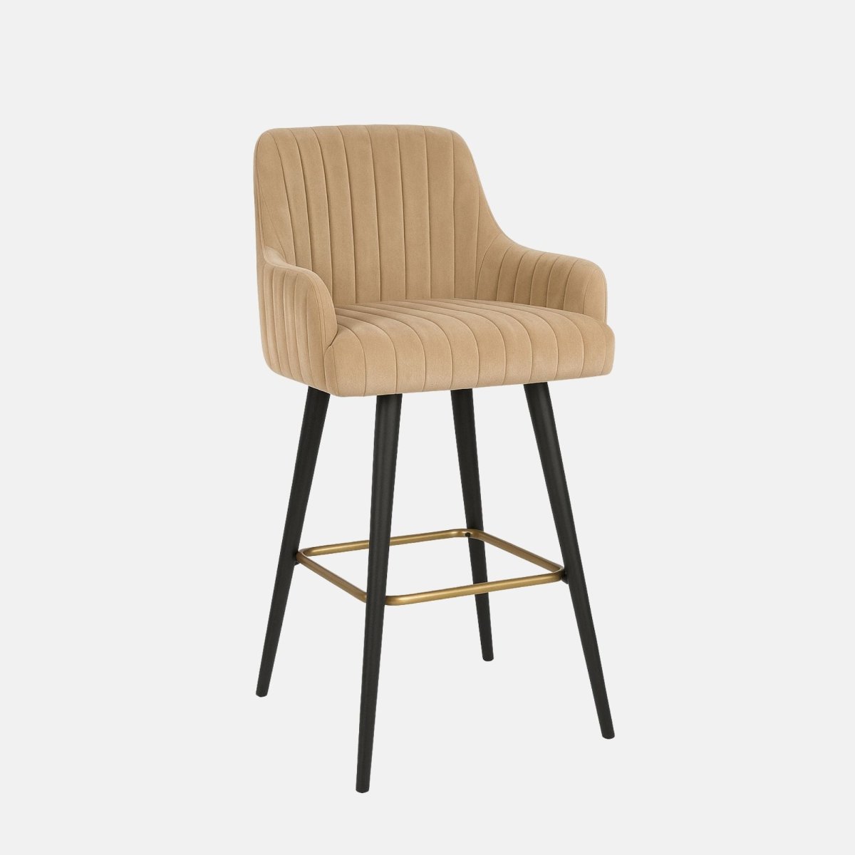 Beige upholstered bar stool with vertical channel stitching, curved armrests, black tapered legs, and a brass footrest.