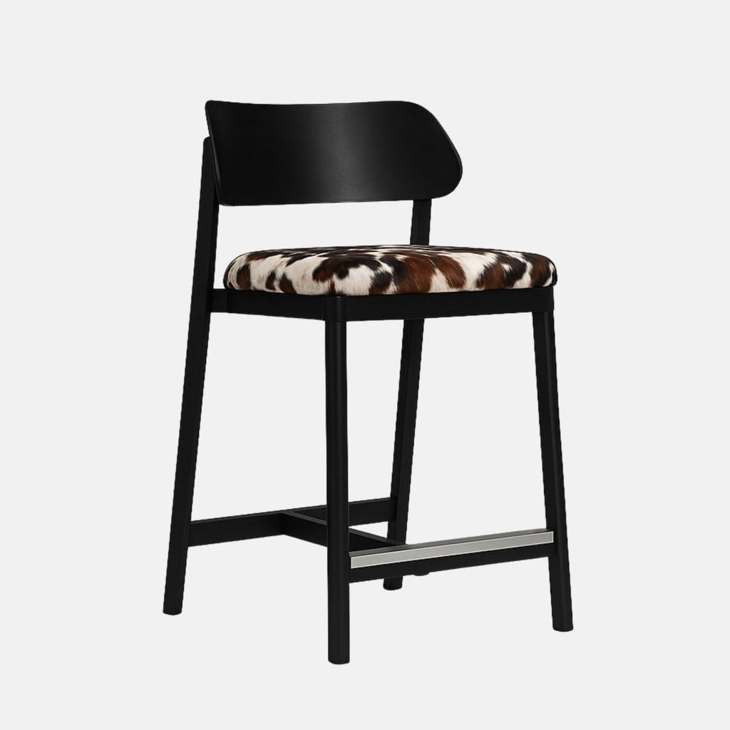 Modern black bar stool with a curved wooden backrest and a cowhide-patterned upholstered seat