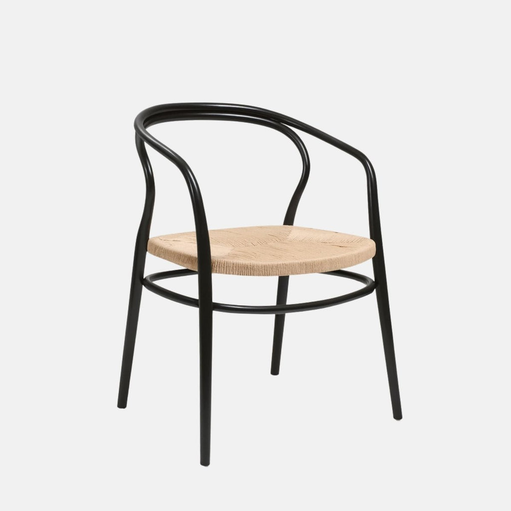 Modern armchair with a black curved metal frame and a woven natural rope seat.