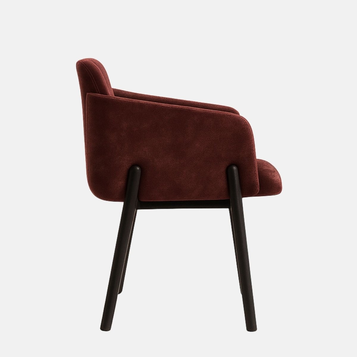 Contemporary armchair with a dark wooden frame and legs, featuring a deep burgundy velvet upholstered seat, backrest, and sides with vertical channel stitching, set against a light grey background