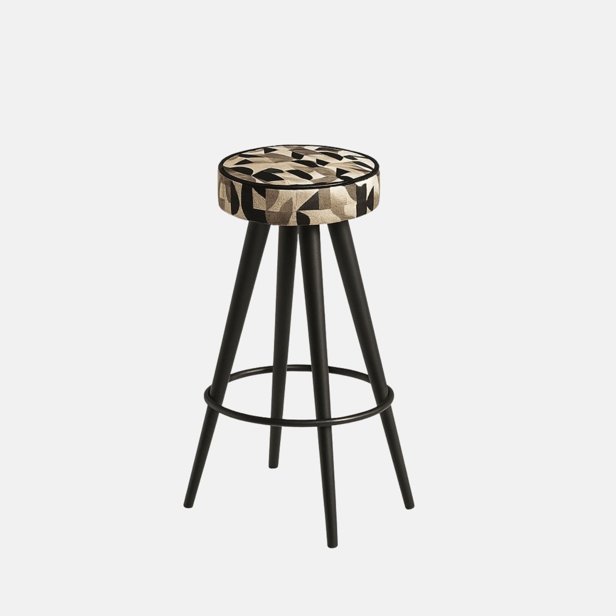 Modern bar stool with a round cushioned seat in a geometric beige and black fabric, supported by black tapered legs connected with a circular footrest.