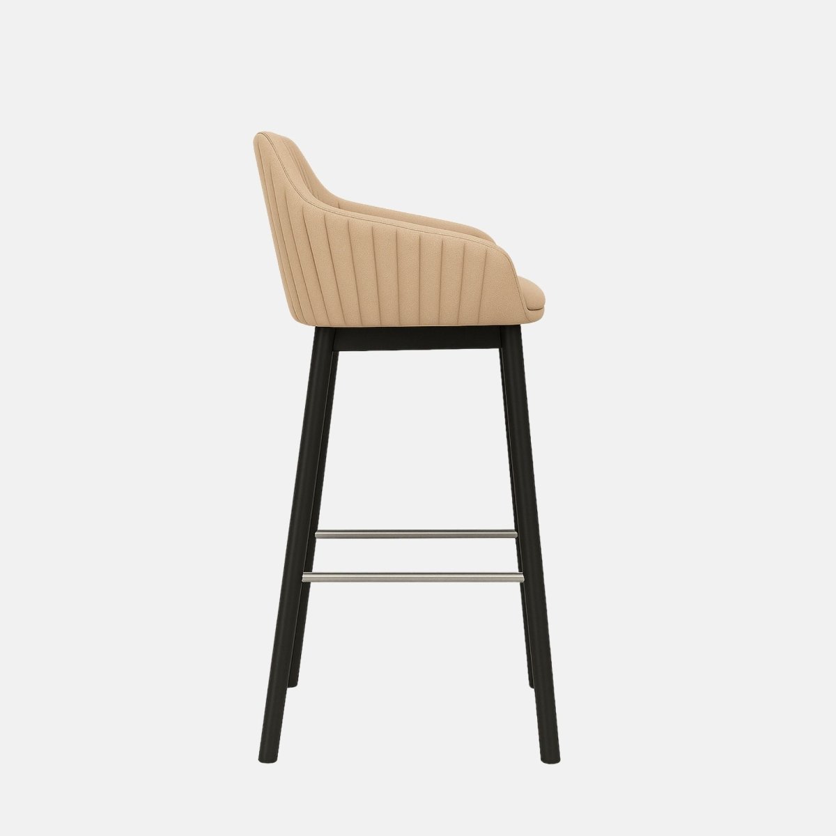Beige upholstered bar stool with a curved backrest and armrests, subtle vertical stitching, black wooden legs, and a metal footrest.